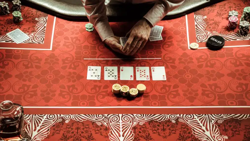 Closeup of a dealer at a poker table